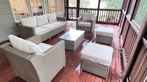 Outdoor patio furniture set on a wooden deck