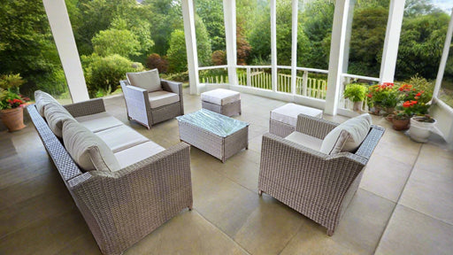 Outdoor patio furniture set with a view of greenery